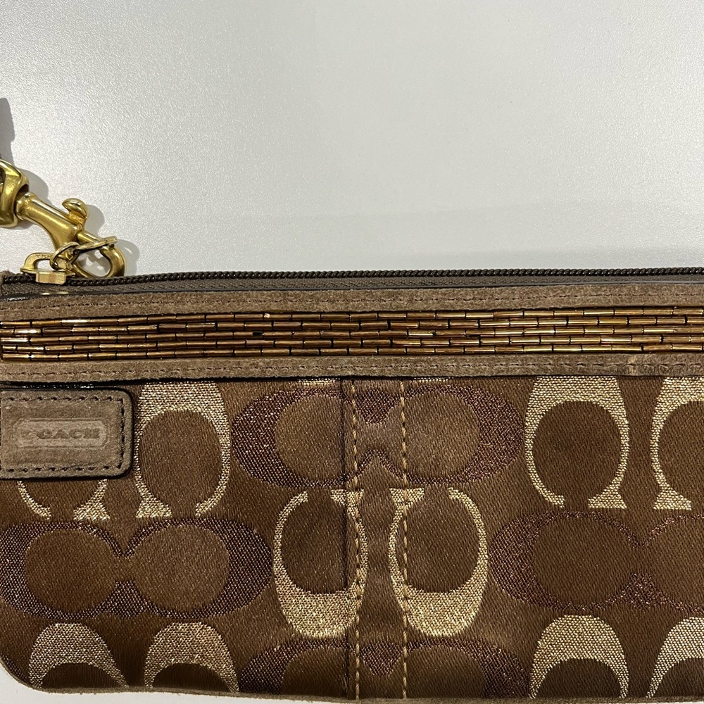 Women’s Brown and Gold Coach Wristlet